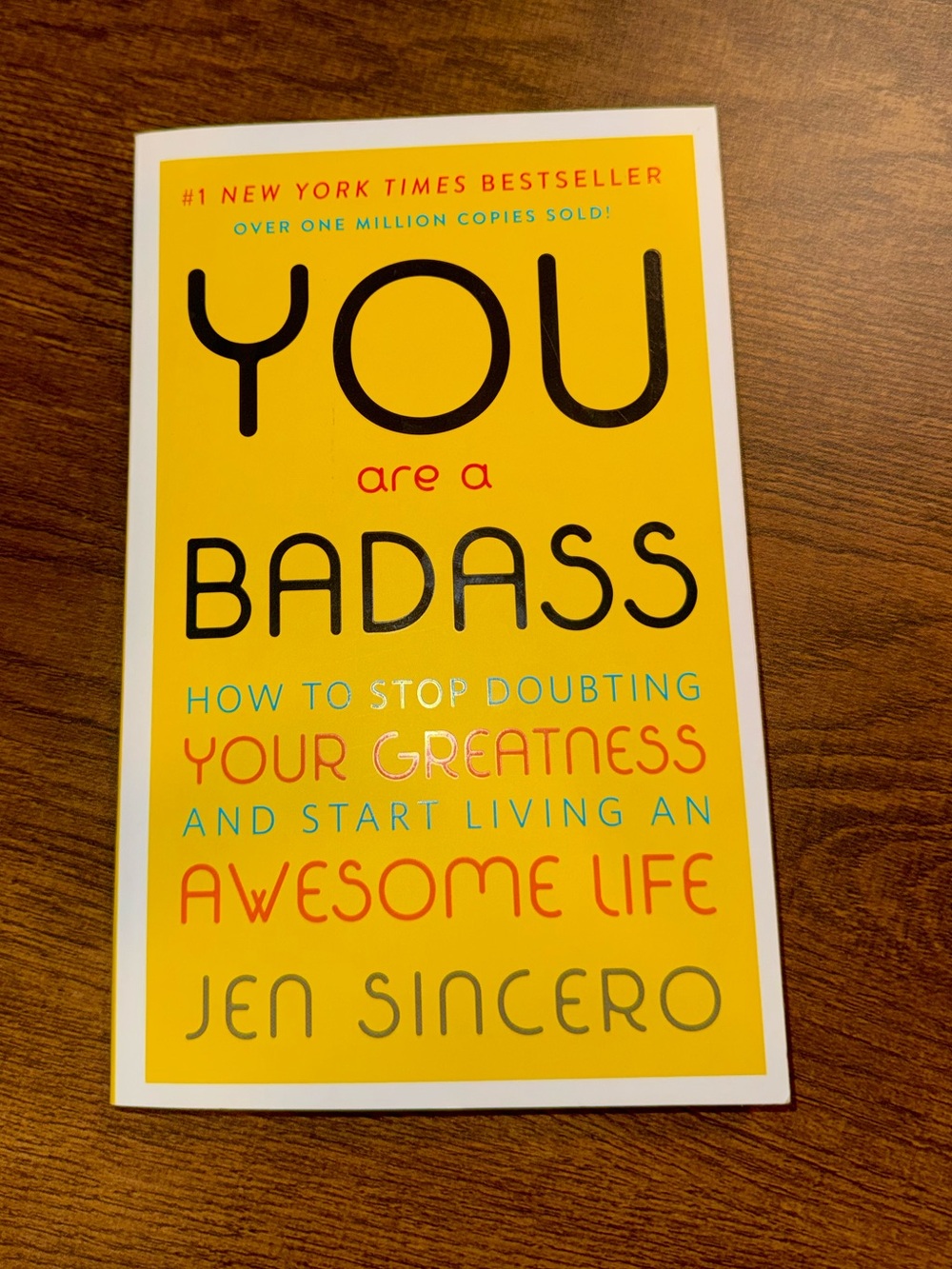 You Are a Badass by Jen Sincero - Yellow Paperback Self-Help Book